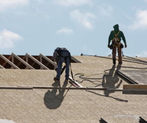 Workers fixing a roof
